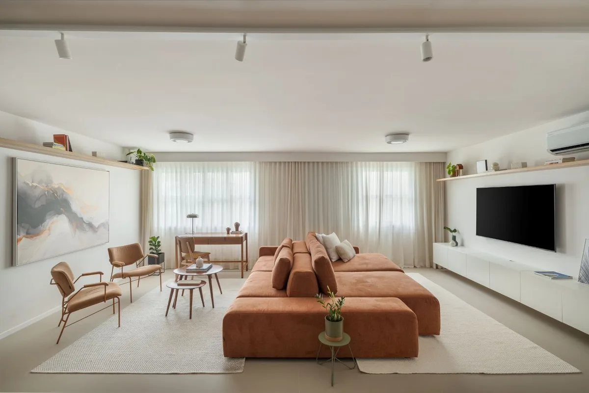 Apartamento em Higienópolis ganha living ampliado com cozinha integrada